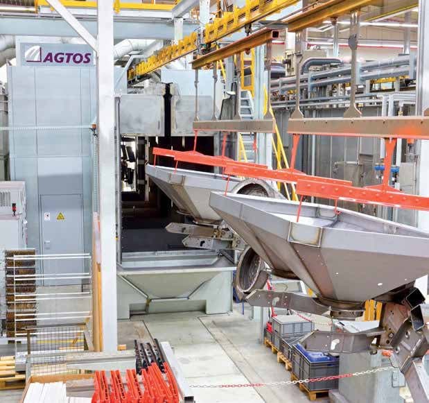 Continuous overhead rail blast machine